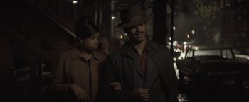 Movie still from “Respect” (2021), directed by Liesl Tommy – A man and a woman are walking in the dark; Medium shot, Over the shoulder angle