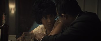 Movie still from “Respect” (2021), directed by Liesl Tommy – A woman sitting at a table with a man in a suit; Close Up shot, Over the shoulder angle