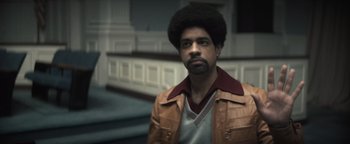 Movie still from “Respect” (2021), directed by Liesl Tommy – A man in a brown leather jacket with a beard; Close Up shot, Low angle