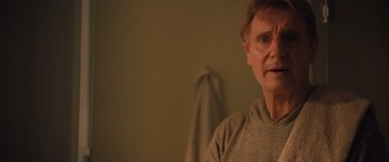 Movie still from “Retribution” (2023), directed by Nimród Antal – A person wearing a gray shirt; Close Up shot, Over the shoulder angle