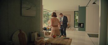 Movie still from “Retribution” (2023), directed by Nimród Antal – A man and a woman standing in front of a window; Wide shot, Low angle