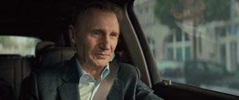 Movie still from “Retribution” (2023), directed by Nimród Antal – A person sitting in a car; Close Up shot, Over the shoulder angle