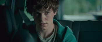 Movie still from “Retribution” (2023), directed by Nimród Antal – A person in a car looking at the camera; Close Up shot, Over the shoulder angle