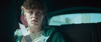 Movie still from “Retribution” (2023), directed by Nimród Antal – A man sitting in the back seat of a car; Close Up shot, Over the shoulder angle