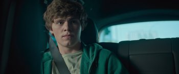 Movie still from “Retribution” (2023), directed by Nimród Antal – A man sitting in the back seat of a car; Close Up shot, Low angle