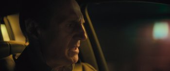 Movie still from “Retribution” (2023), directed by Nimród Antal – An older man looking out of a car window at night; Close Up shot, Over the shoulder angle