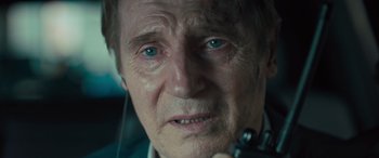 Movie still from “Retribution” (2023), directed by Nimród Antal – An older man with blue eyes looking at the camera; Close Up shot, Over the shoulder angle
