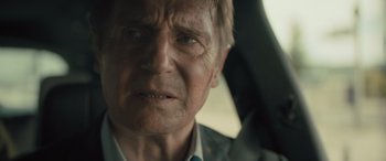 Movie still from “Retribution” (2023), directed by Nimród Antal – An older man in a car looking at the camera; Close Up shot, Over the shoulder angle