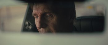 Movie still from “Retribution” (2023), directed by Nimród Antal – A man's face looking out of a window; Close Up shot, Low angle