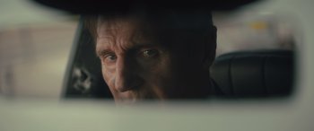Movie still from “Retribution” (2023), directed by Nimród Antal – A man's face looking out a window; Close Up shot, Over the shoulder angle