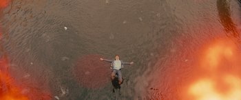 Movie still from “Retribution” (2023), directed by Nimród Antal – A man floating in a body of water; Extreme Wide shot, Overhead angle