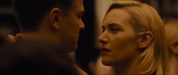 Movie still from “Revolutionary Road” (2008), directed by Sam Mendes – A man and a woman face to face in front of a mirror; Close Up shot, Low angle