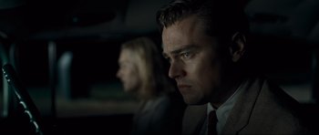 Movie still from “Revolutionary Road” (2008), directed by Sam Mendes – A person wearing a suit and tie; Close Up shot, Low angle