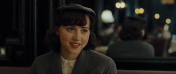 Movie still from “Revolutionary Road” (2008), directed by Sam Mendes – A young woman wearing a hat and a jacket; Close Up shot, Over the shoulder angle