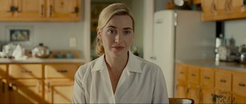 Movie still from “Revolutionary Road” (2008), directed by Sam Mendes – A person wearing a white shirt; Close Up shot, Over the shoulder angle