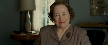 Movie still from “Revolutionary Road” (2008), directed by Sam Mendes – A person wearing a brown shirt; Close Up shot, Over the shoulder angle