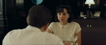 Movie still from “Revolutionary Road” (2008), directed by Sam Mendes – A woman sitting in front of a man at a table; Close Up shot, Over the shoulder angle