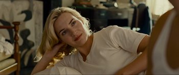 Movie still from “Revolutionary Road” (2008), directed by Sam Mendes – A beautiful blond woman laying on the ground; Close Up shot, Over the shoulder angle