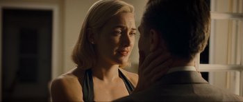 Movie still from “Revolutionary Road” (2008), directed by Sam Mendes – A man and a woman looking at one another; Close Up shot, Over the shoulder angle