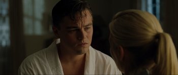 Movie still from “Revolutionary Road” (2008), directed by Sam Mendes – A man in a white robe looking at a woman in a white robe; Close Up shot, Over the shoulder angle
