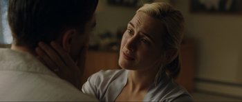 Movie still from “Revolutionary Road” (2008), directed by Sam Mendes – A person sitting in front of another person; Close Up shot, Over the shoulder angle