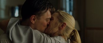 Movie still from “Revolutionary Road” (2008), directed by Sam Mendes – A man and a woman kissing each other; Close Up shot, Low angle