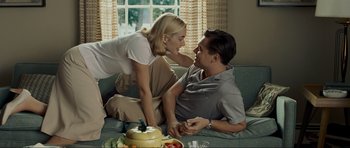 Movie still from “Revolutionary Road” (2008), directed by Sam Mendes – A man and a woman sitting on a couch; Medium shot, Low angle