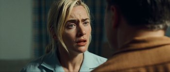 Movie still from “Revolutionary Road” (2008), directed by Sam Mendes – A person looking at a mirror; Close Up shot, Over the shoulder angle