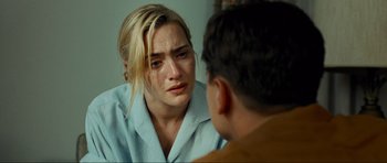 Movie still from “Revolutionary Road” (2008), directed by Sam Mendes – A man and a woman looking at each other in a mirror; Close Up shot, Over the shoulder angle