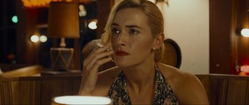 Movie still from “Revolutionary Road” (2008), directed by Sam Mendes – A person talking on a cell phone; Close Up shot, Over the shoulder angle