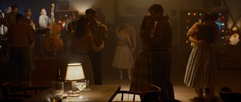 Movie still from “Revolutionary Road” (2008), directed by Sam Mendes – A group of people standing in a room; Wide shot, Low angle
