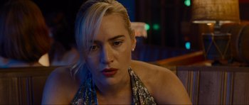 Movie still from “Revolutionary Road” (2008), directed by Sam Mendes – A person sitting in front of a camera; Close Up shot, High angle