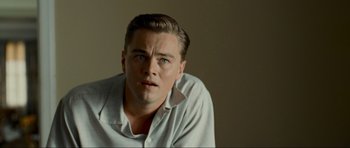 Movie still from “Revolutionary Road” (2008), directed by Sam Mendes – A person wearing a white shirt; Close Up shot, Over the shoulder angle