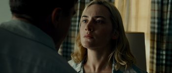 Movie still from “Revolutionary Road” (2008), directed by Sam Mendes – A man and a woman looking at one another; Close Up shot, Over the shoulder angle