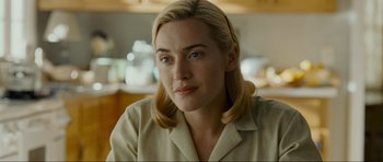 Movie still from “Revolutionary Road” (2008), directed by Sam Mendes – A person with blonde hair; Close Up shot, Over the shoulder angle