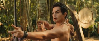 Movie still from “Rich in Love 2” (2023), directed by Bruno Garotti – A man that is standing in the woods; Close Up shot, Over the shoulder angle