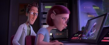 Movie still from “Rio” (2011), directed by Carlos Saldanha – A cartoon of a woman with glasses and a man with glasses looking at a computer screen; Medium shot, Over the shoulder angle