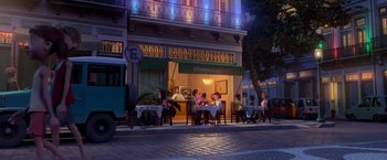 Movie still from “Rio” (2011), directed by Carlos Saldanha – A group of people sitting at an outside restaurant; Wide shot, Over the shoulder angle