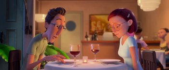 Movie still from “Rio” (2011), directed by Carlos Saldanha – Two people sitting at a table with wine glasses on it; Medium shot, Over the shoulder angle