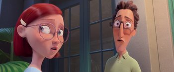 Movie still from “Rio” (2011), directed by Carlos Saldanha – A woman and a man are standing next to each other in front of a building; Close Up shot, Over the shoulder angle