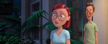 Movie still from “Rio” (2011), directed by Carlos Saldanha – An animated woman with red hair wearing glasses and a blue shirt; Close Up shot, Over the shoulder angle