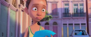 Movie still from “Rio” (2011), directed by Carlos Saldanha – A cartoon of a boy holding a blue piece of paper in his hand; Close Up shot, Over the shoulder angle