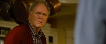 Movie still from “Rise of the Planet of the Apes” (2011), directed by Rupert Wyatt – An older man is looking at the camera; Close Up shot, Low angle