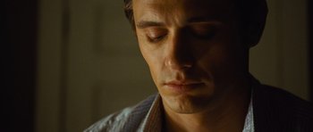 Movie still from “Rise of the Planet of the Apes” (2011), directed by Rupert Wyatt – A person with his eyes closed; Close Up shot, Over the shoulder angle