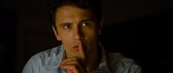 Movie still from “Rise of the Planet of the Apes” (2011), directed by Rupert Wyatt – A person holding his finger to his lips; Close Up shot, High angle