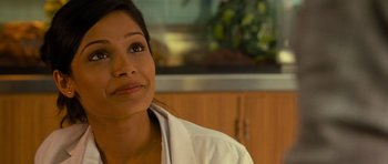 Movie still from “Rise of the Planet of the Apes” (2011), directed by Rupert Wyatt – A person wearing a white shirt; Close Up shot, Over the shoulder angle