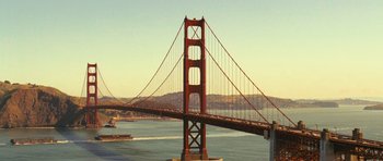 Movie still from “Rise of the Planet of the Apes” (2011), directed by Rupert Wyatt – The golden gate bridge is seen from a distance; Extreme Wide shot, High angle