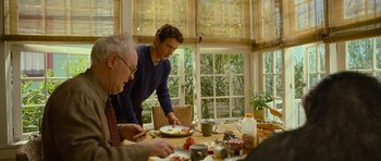 Movie still from “Rise of the Planet of the Apes” (2011), directed by Rupert Wyatt – A man and a woman are standing at a dining room table; Medium shot, Over the shoulder angle