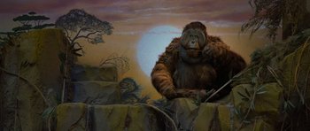 Movie still from “Rise of the Planet of the Apes” (2011), directed by Rupert Wyatt – A painting of a gorilla sitting on top of a hill; Wide shot, Low angle