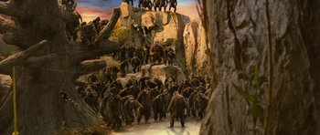 Movie still from “Rise of the Planet of the Apes” (2011), directed by Rupert Wyatt – A group of people standing on a rock formation; Wide shot, High angle